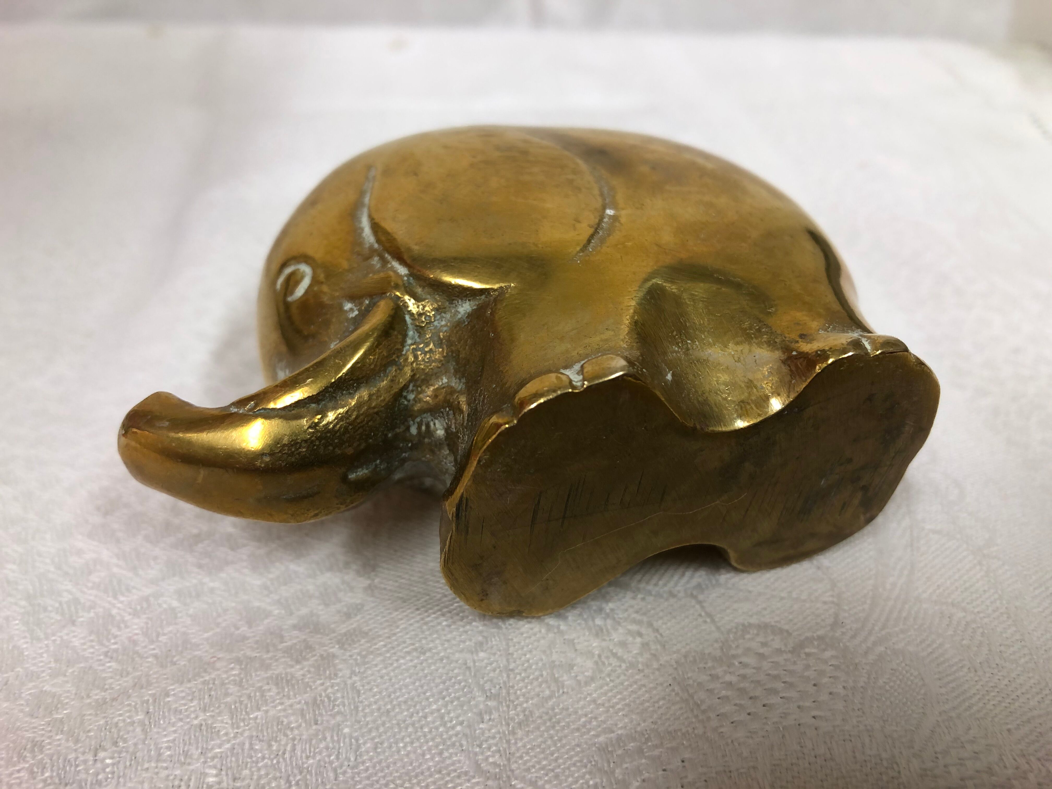 70s golden brass elephant paper press