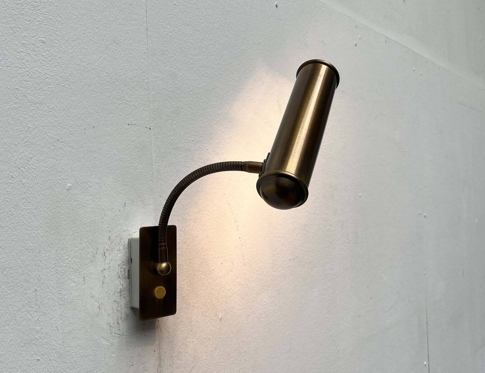 Vintage German brass patinated wall lamp with a gooseneck design by Honsel, 1970s.