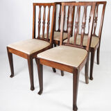 Set of four dining room chairs in rosewood and upholstered with light fabric, 1920s
