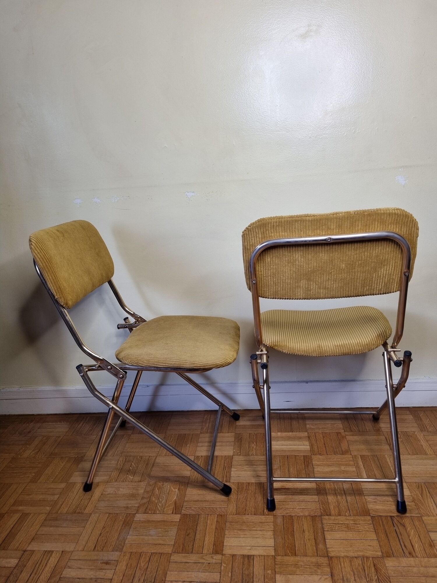 Pair of vintage folding chairs in gilded metal and 70s fabrics, restored