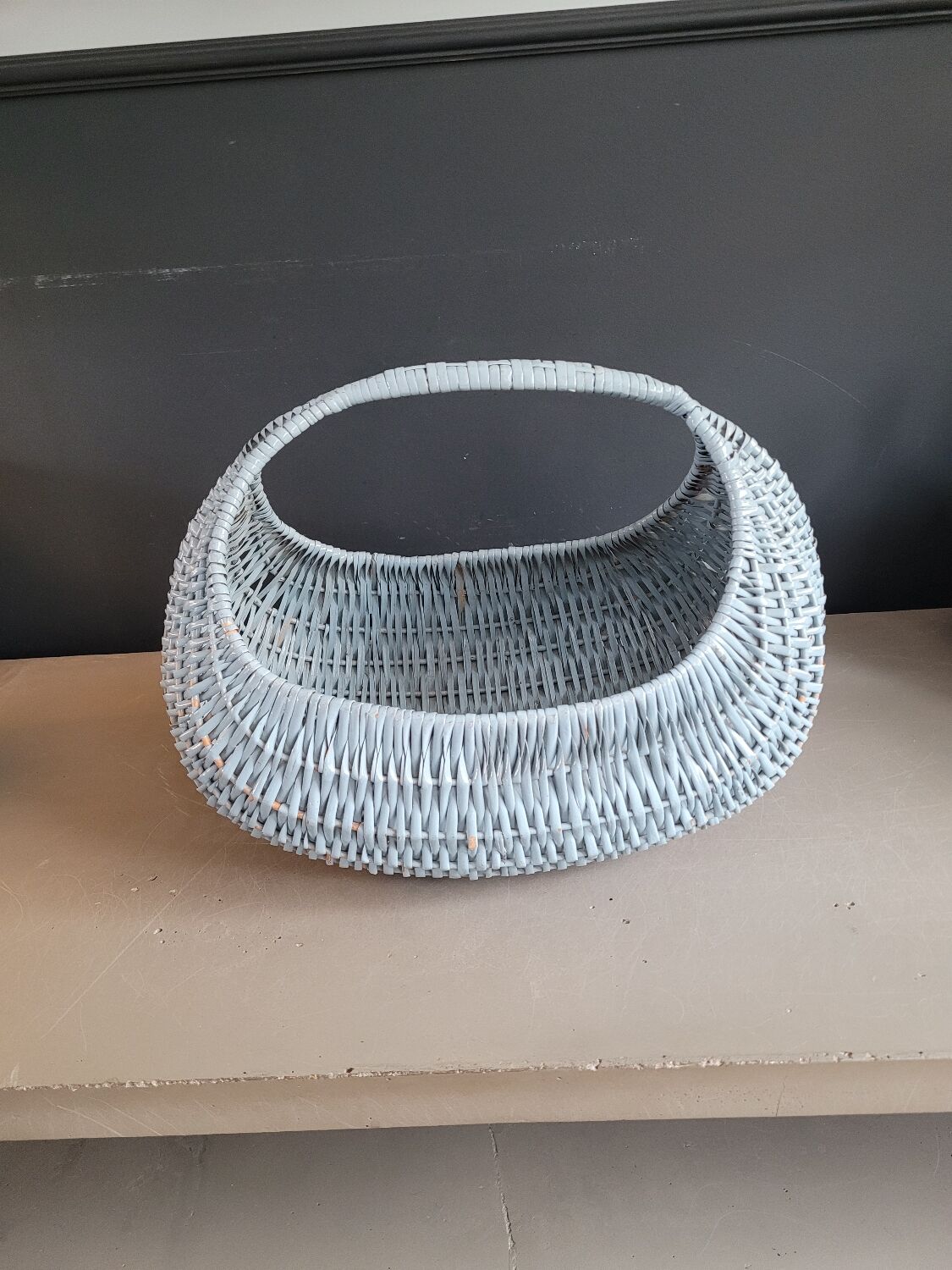 Turquoise-painted wicker basket