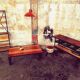 Industrial shelf made of solid exotic mango wood with riveted metal.