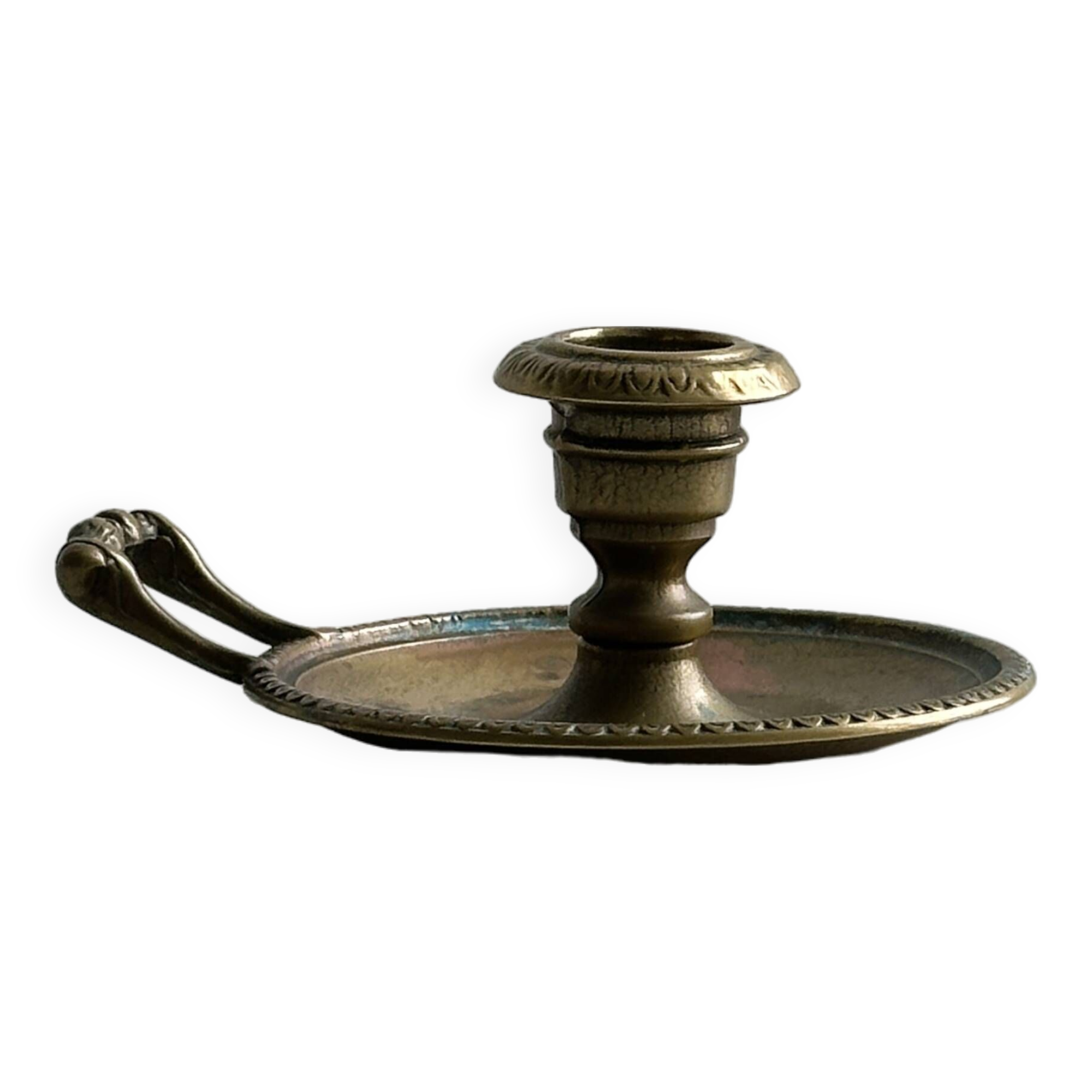 Brass candle holder with handle.