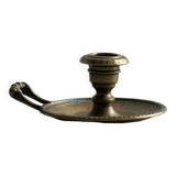 Brass candle holder with handle.