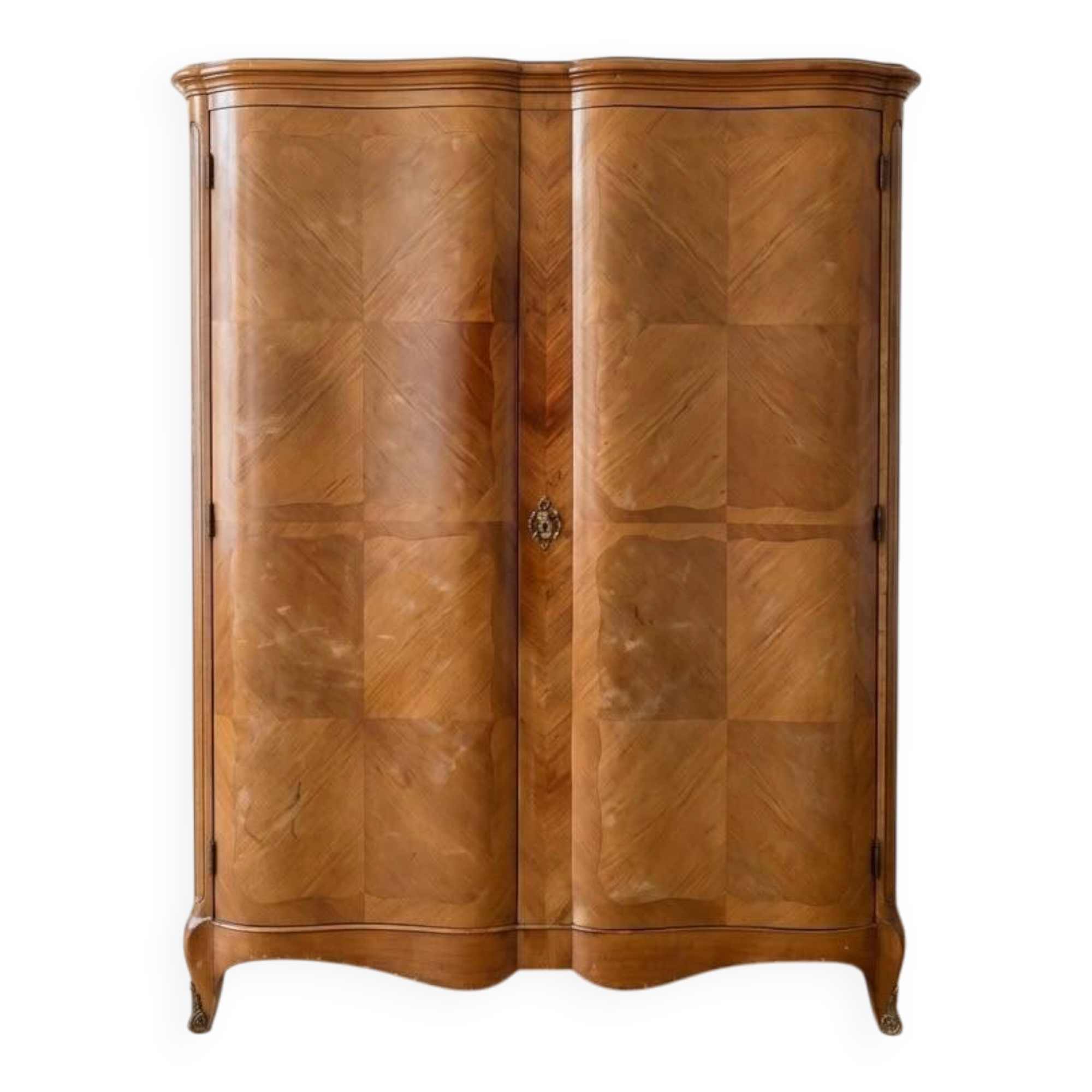 Antique Louis XV style wardrobe with curved wooden doors.