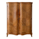 Antique Louis XV style wardrobe with curved wooden doors.
