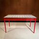 Custom modernist table, steel and earthenware.