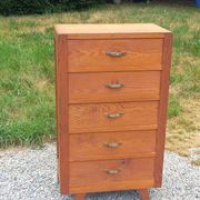 Vintage 1950s chest of drawers with tapered legs and 5 drawers.