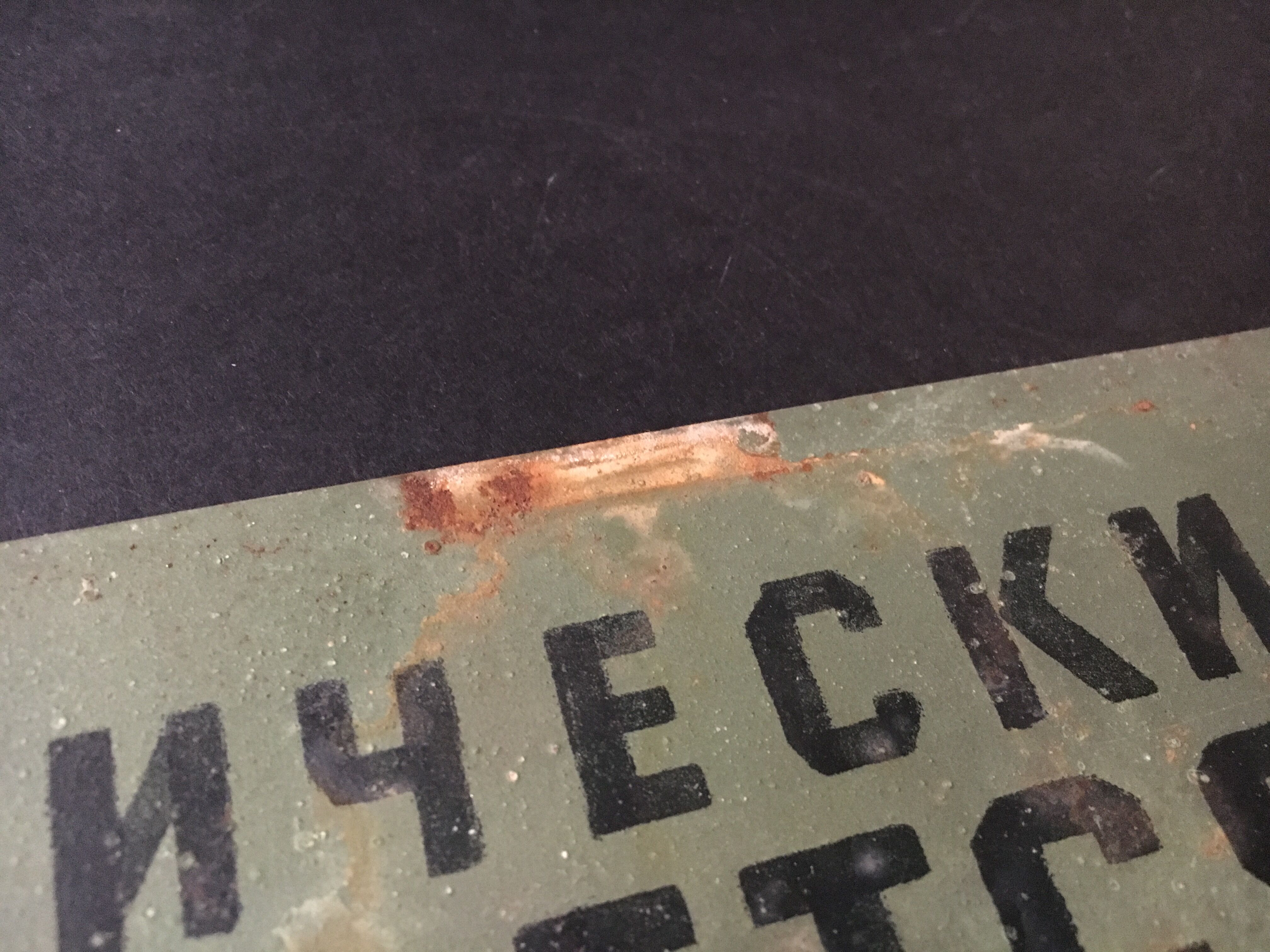 Old factory plaque in painted tin