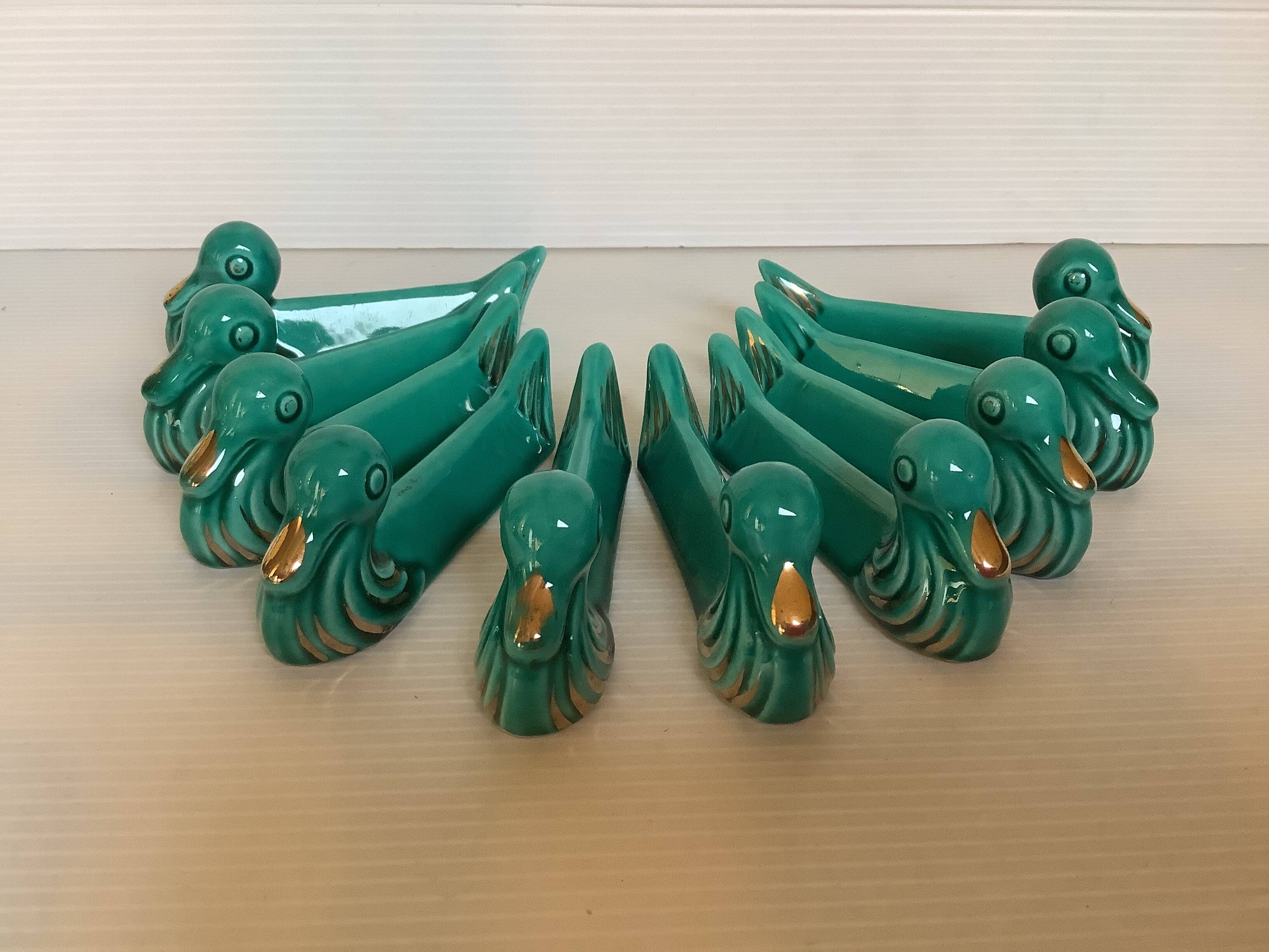 Dix porte couteaux canard vert et or