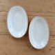 Vintage white porcelain trays with a golden rim.