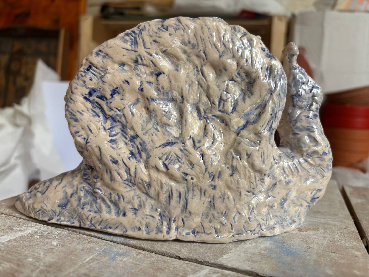 Blue and white ceramic snail