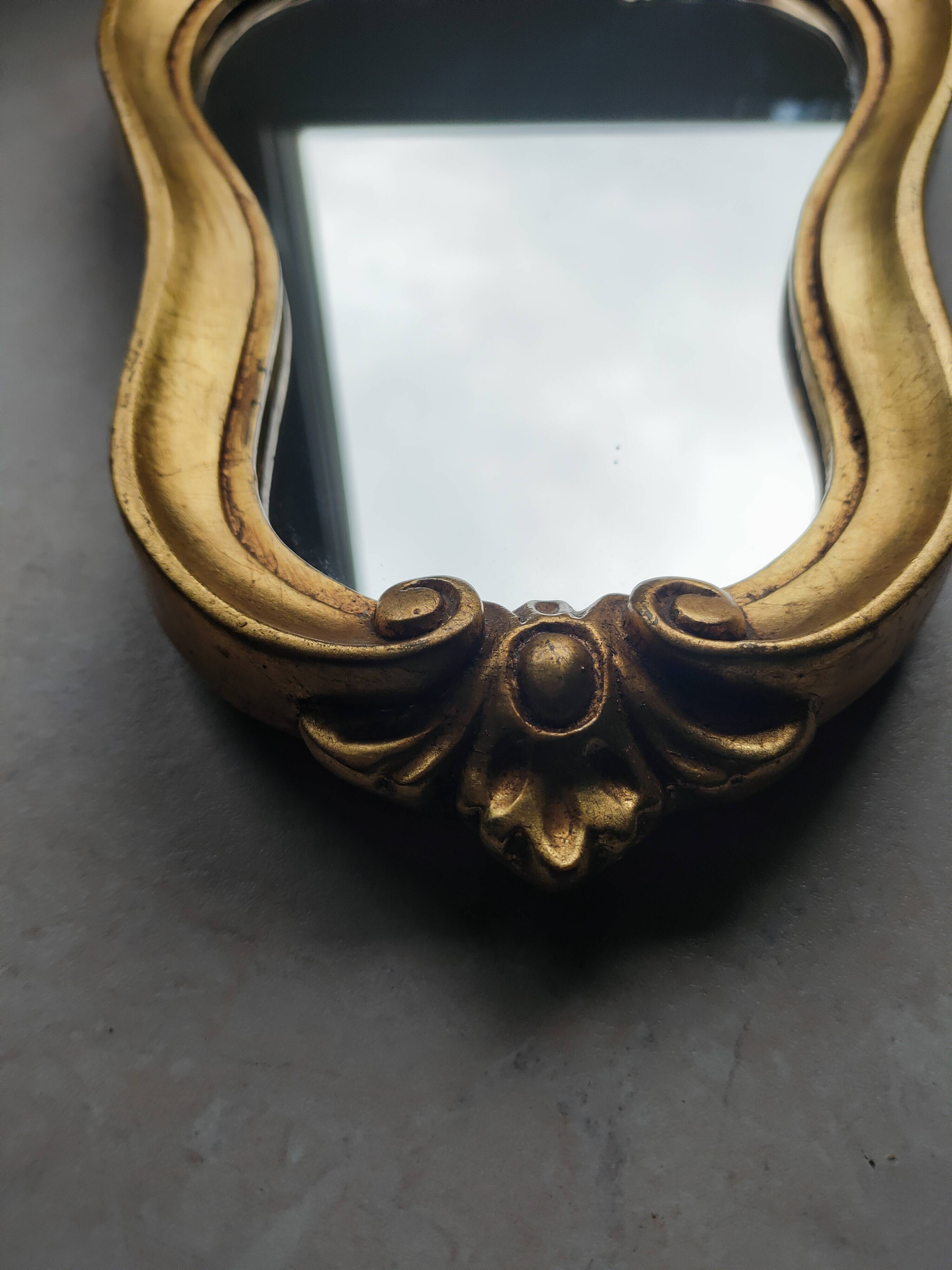 Baroque style gilded mirror.