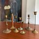 Set 7 mismatched brass and bronze candlesticks
