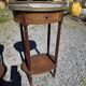 Pair of Louis XVI style bedside tables in mahogany, with marble tops.