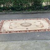 Persian rug in beige wool with woven flowers 290x190cm