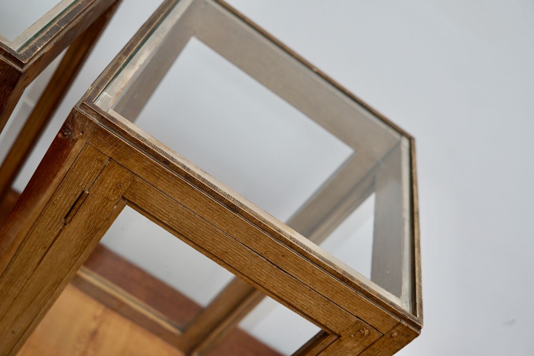 pair of faux oak shop display cabinets, circa 1920s