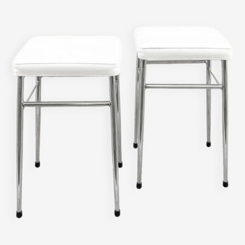 Pair of chrome stools with white skai seat