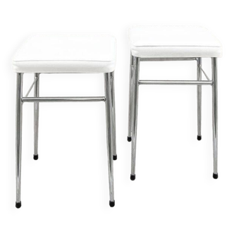 Pair of chrome stools with white skai seat