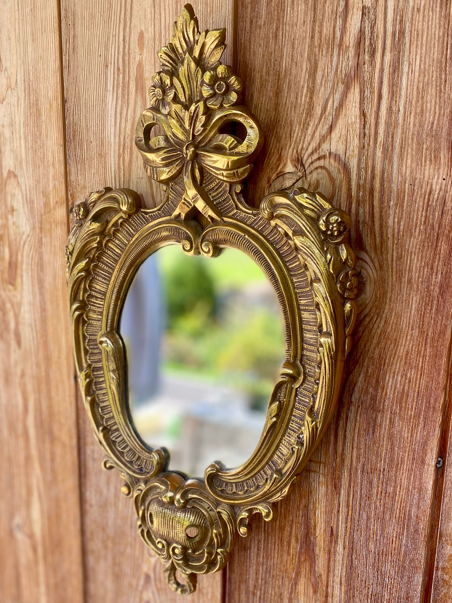 oval decorative wall mirror in Louis XV style