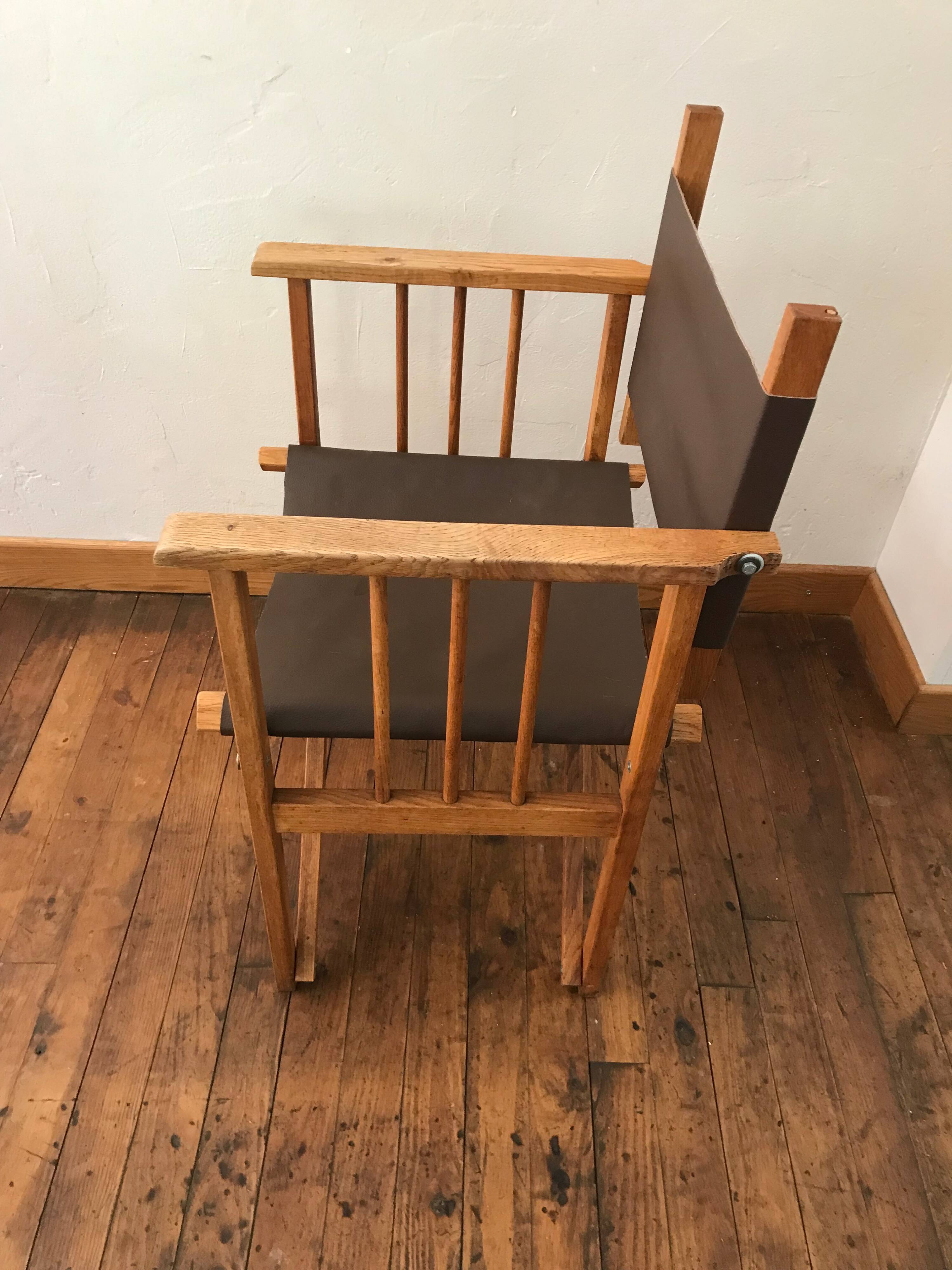 pair of Safari armchairs in wood and leather