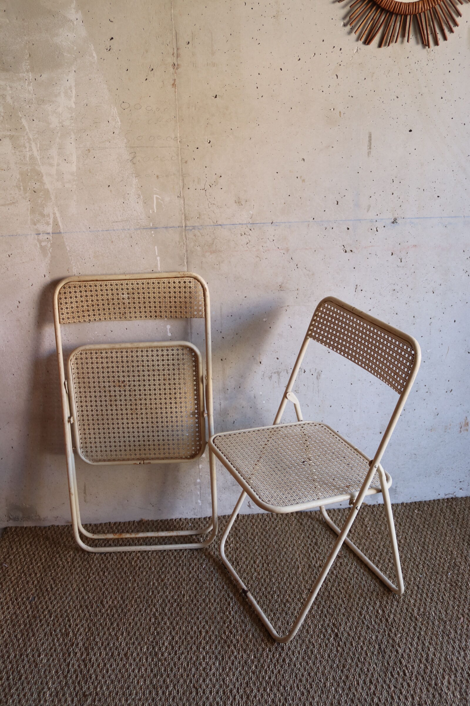 Two metal tanned folding chairs