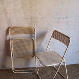 Two metal tanned folding chairs