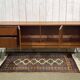 1970s English enfilade in teak with splayed legs.