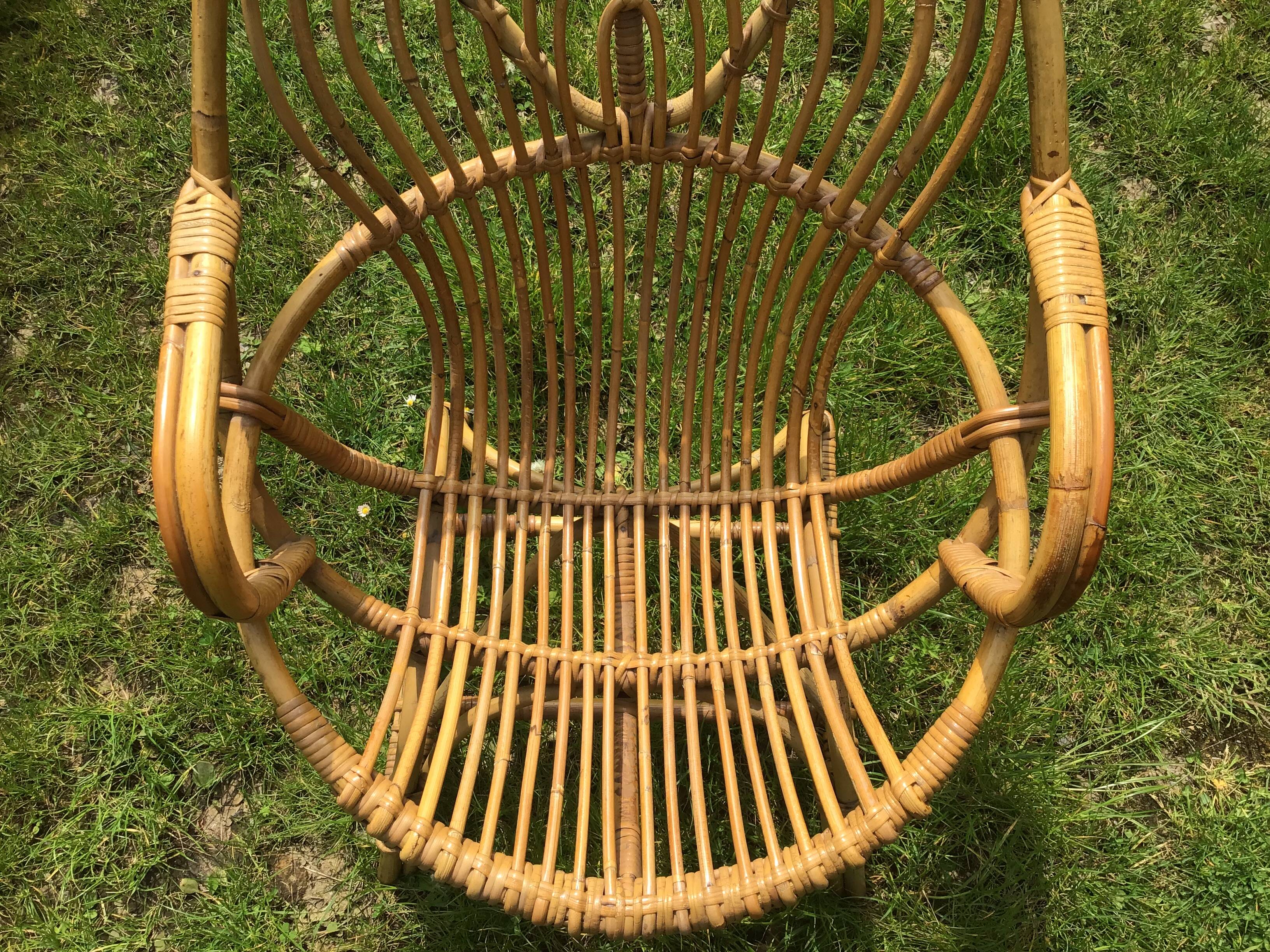 Vintage ovoid-shaped rattan armchair.