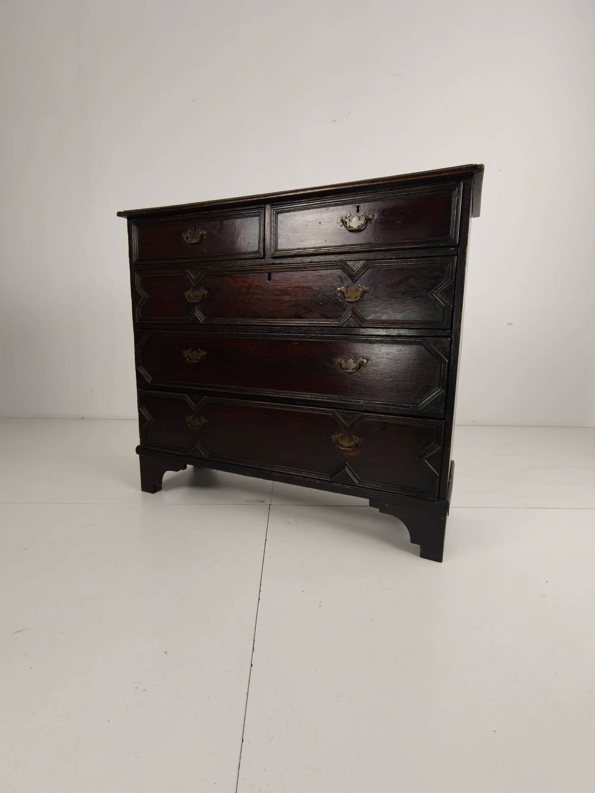 English geometric-panelled oak chest of drawers, circa 1680