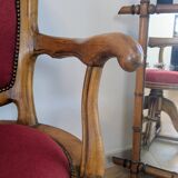 Vintage captain's chair in wood and garnet fabric — a seat with character