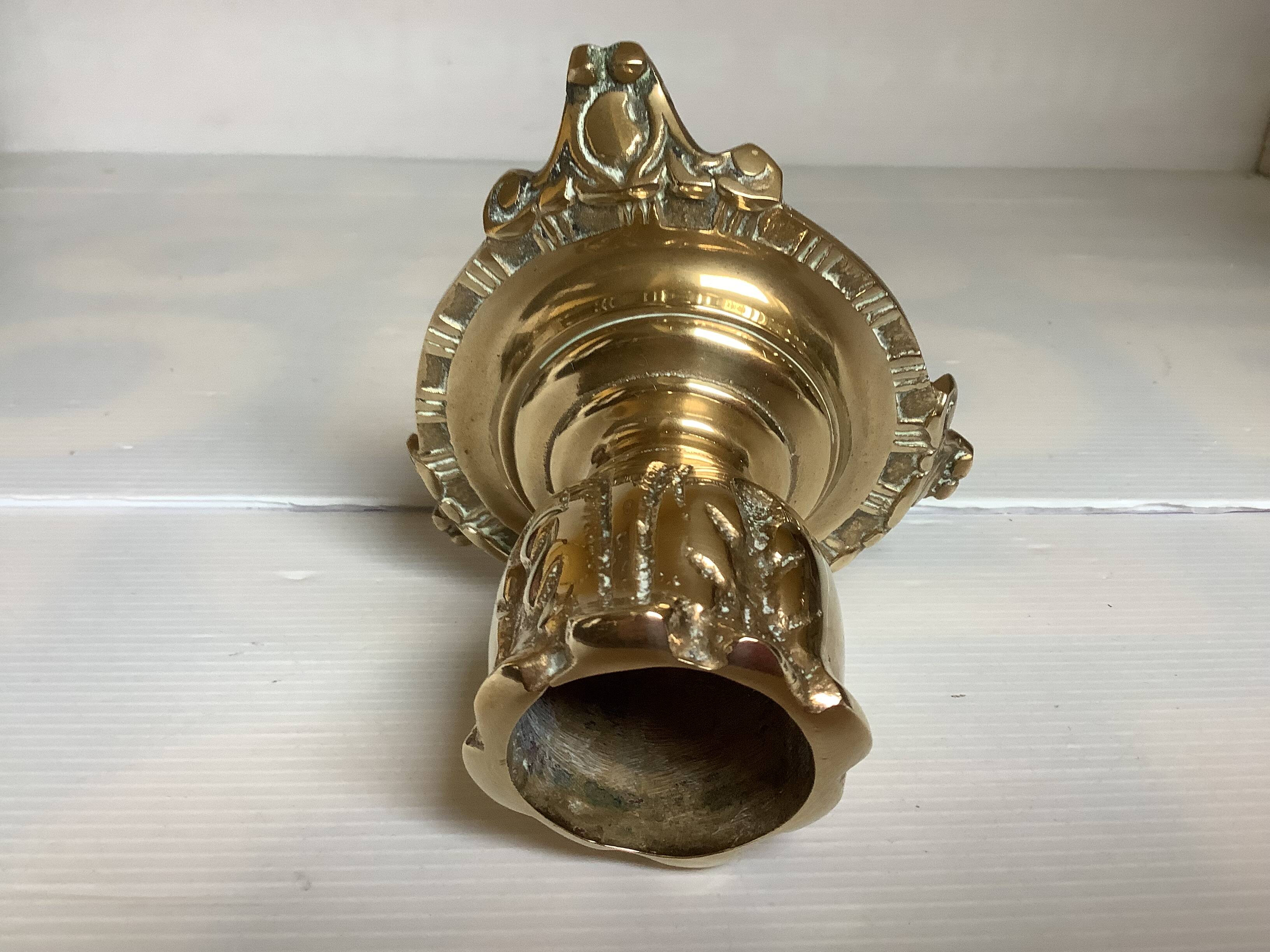 Tripod candlestick in worked bronze