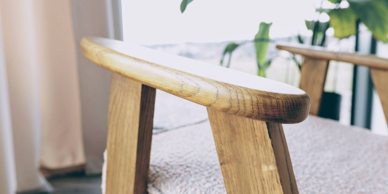 Vintage armchair in oak wood with powder pink boucle design by Chierowski.