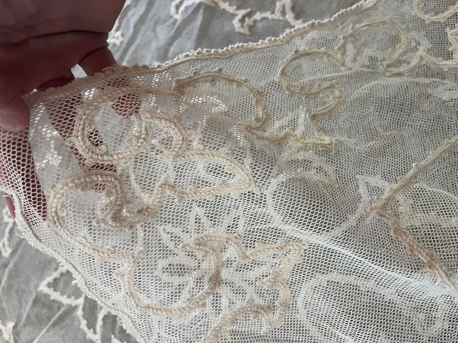 Old tablecloth embroidered with openwork embroidery.