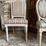 Pair of Louis XVI style chairs in painted wood and satin, classic elegance.
