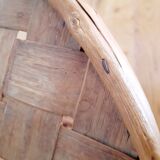 Old bamboo/rattan table with woven palm leaves.