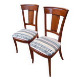 2 varnished solid wood chairs with "ethnic" padding