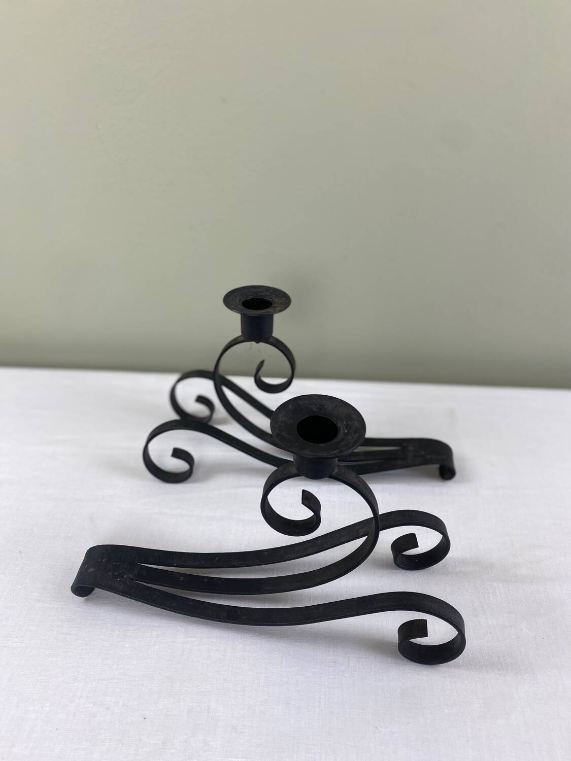 Pair of wrought iron candlesticks