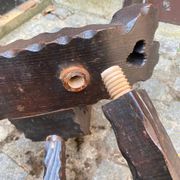 Vintage brutalist tripod chair in carved wood with wooden screw assembly XI.