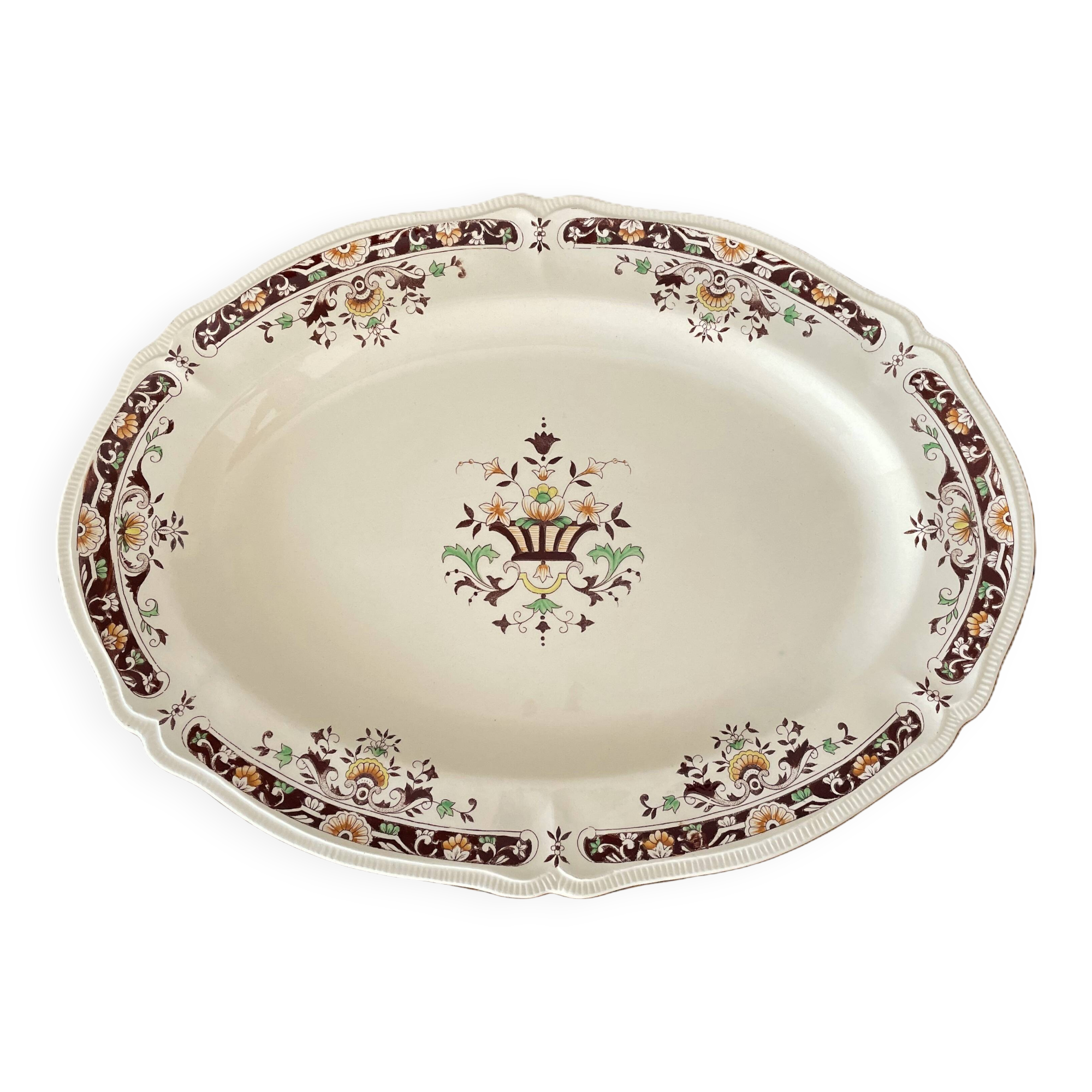 Antique serving dish in Longchamp earthenware.