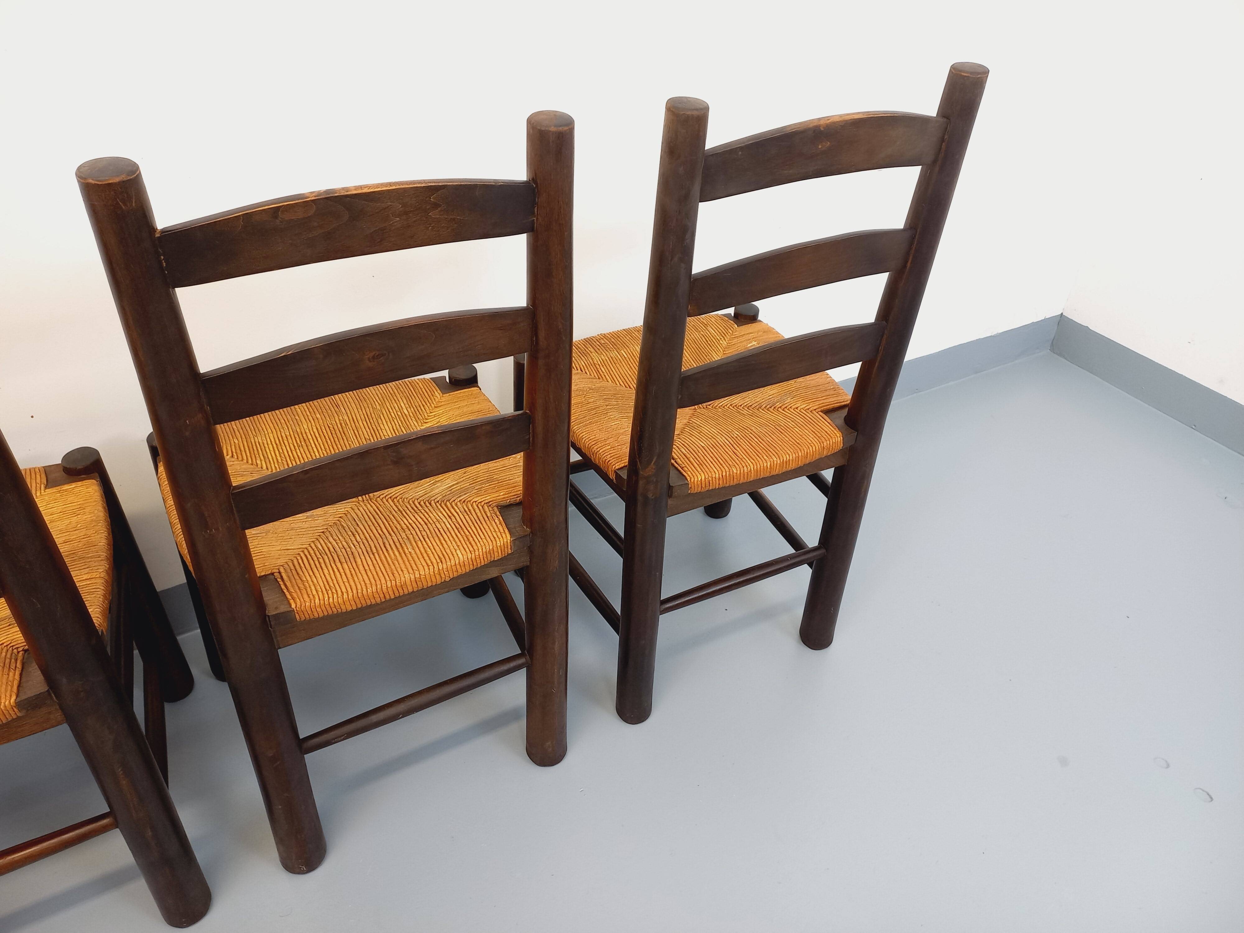 Set of 4 vintage brutalist chairs by Georges Robert in wood and straw.