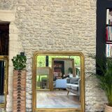 Louis-Philippe mantel mirror 133cm/115.5cm beaded gilded with gold leaf geometric decoration, late 19th century, heavily pitted and scratched glass, parquet on the back.