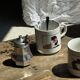 Pair of mugs with stylized Italian women motifs