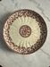 Presentation plate on a pedestal, antique Gien.