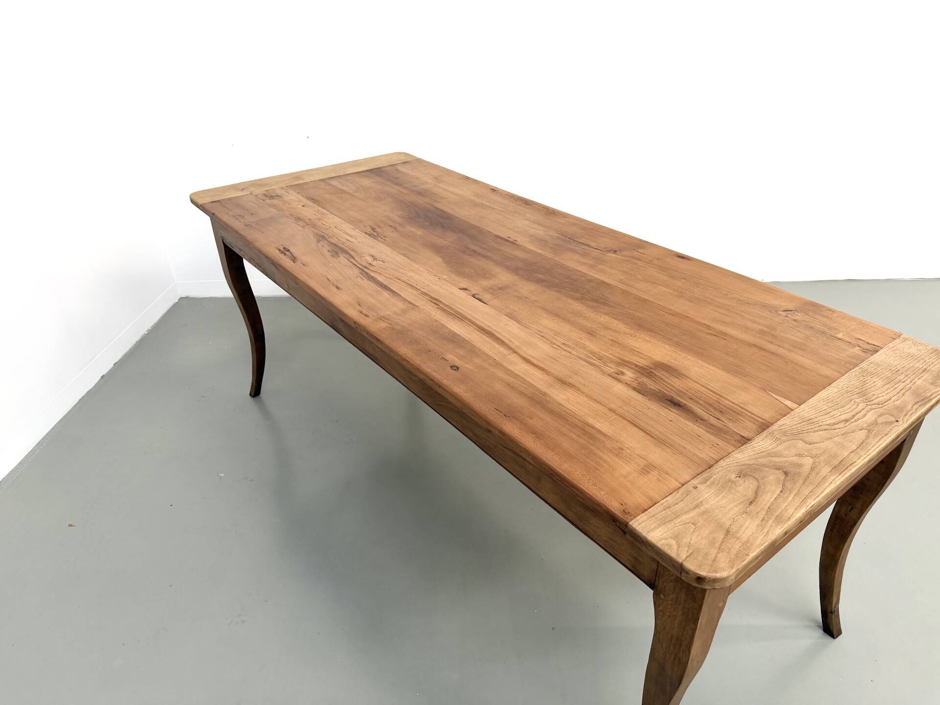 Farm table in solid cherry — Saber legs, Circa 1880