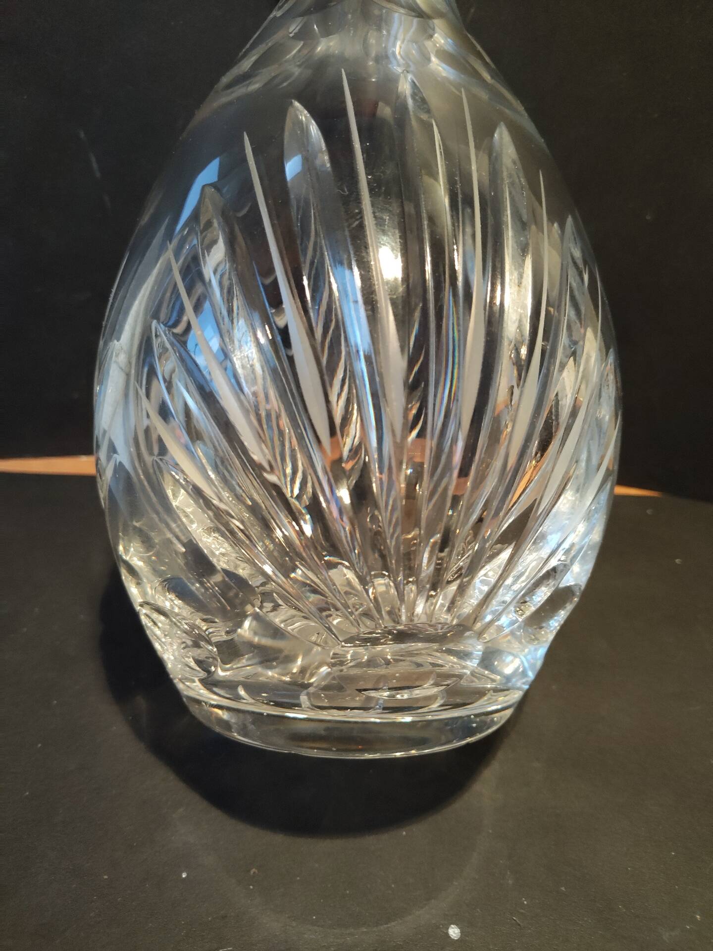 Vintage cut crystal carafe with floral stopper.