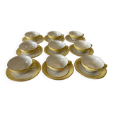 Yellow and white cups and saucers with gold trim Moulin des loups