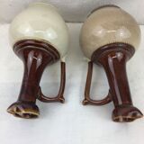 Antique handmade pitchers in beige and brown enamelled terracotta