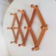 Vintage accordion wall coat rack