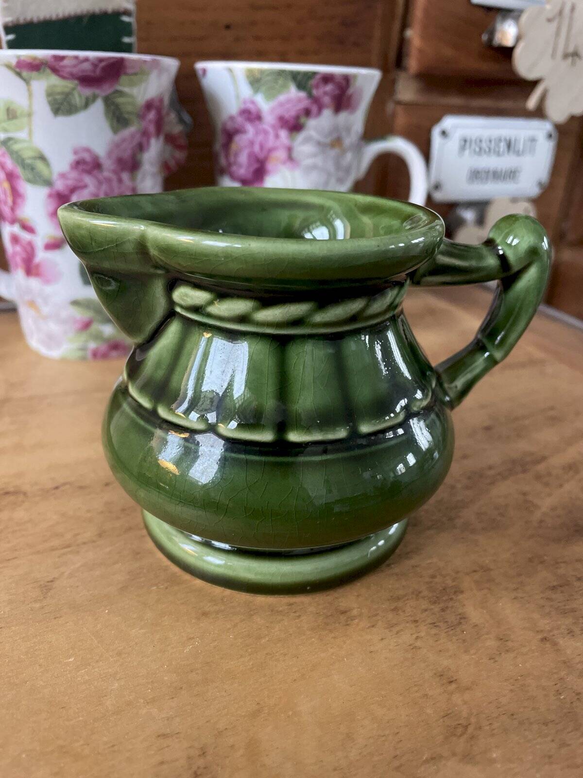 Green ceramic milk jug